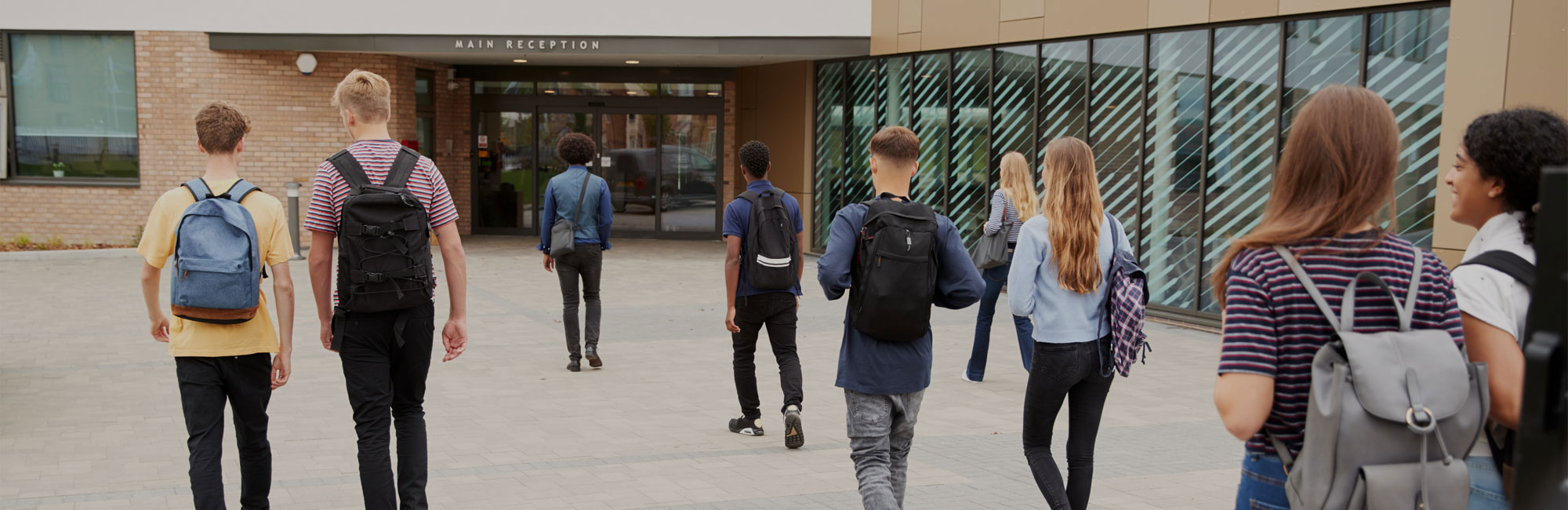 College students walking into reception