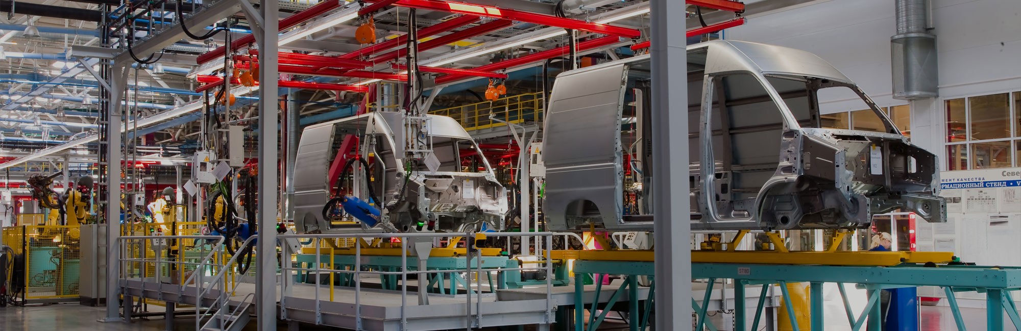 Vans being manufactured in factory